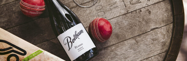 Botham Series 81 Series bottle with a cricket bat and cricket ball on a wine barrel